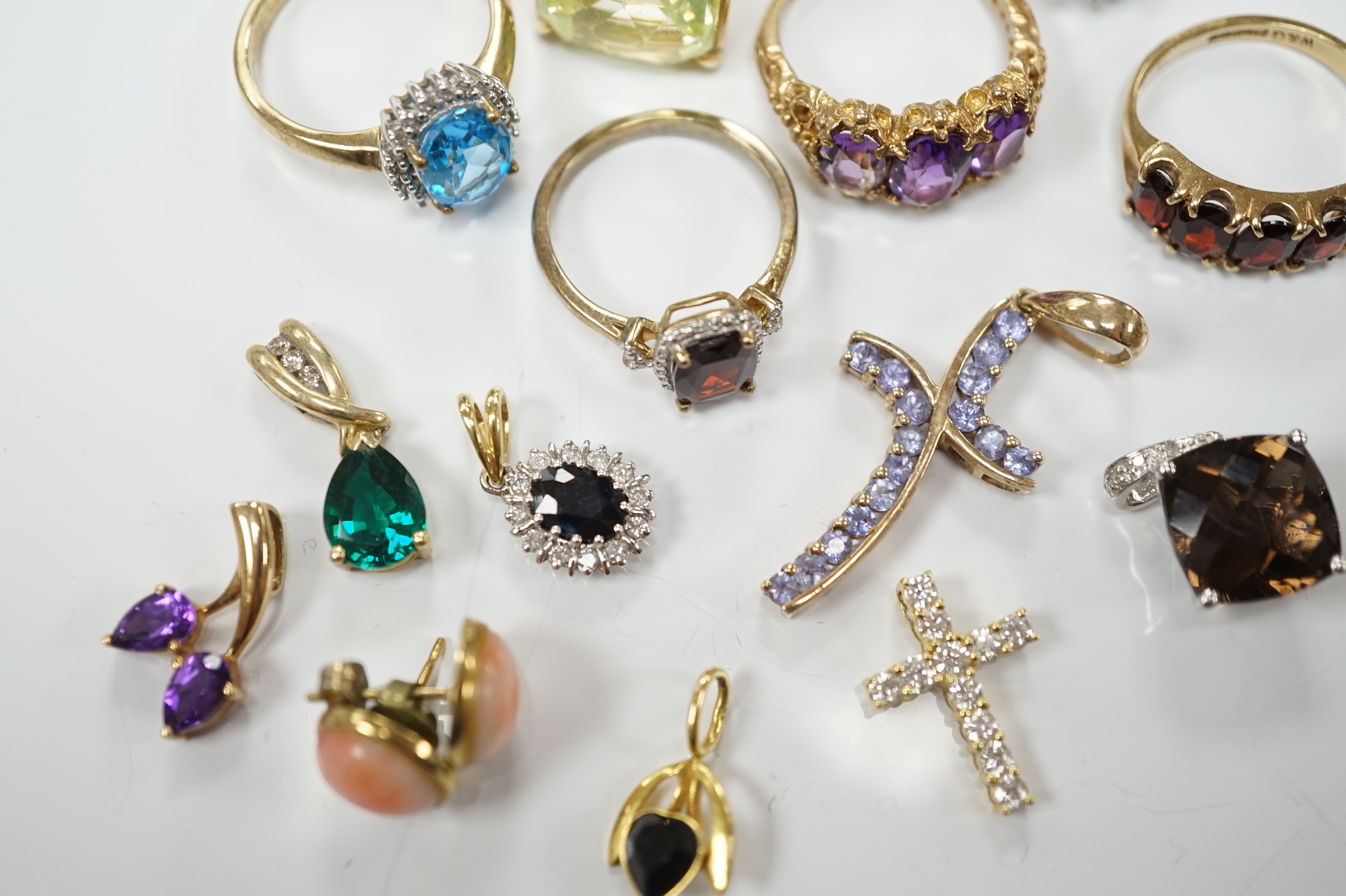 Five assorted modern 9ct gold and gem set rings, including garnet and amethyst, one other yellow metal and gem set ring, six assorted modern 9ct gold and gem set pendants, two other pendants including diamond set cross a